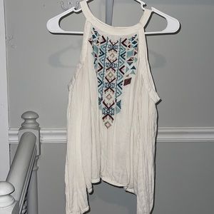 Cream off-shoulder long sleeve w tribal print, high neck